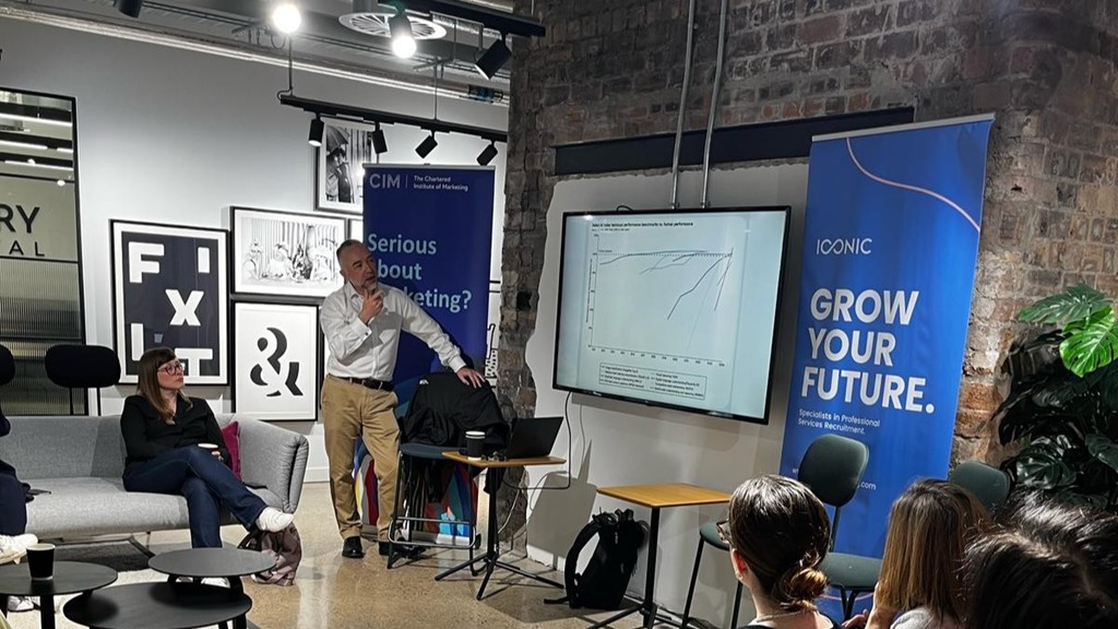 Alan Black discussing a graph that shows how AI performance can exceed that of humans